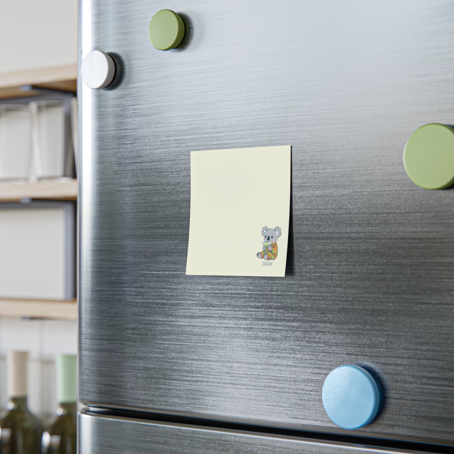Fridge with colorful magnets and a sticky note attached