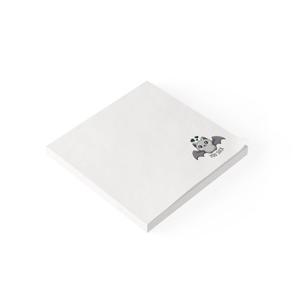 White notepad with a bat illustration on a white background