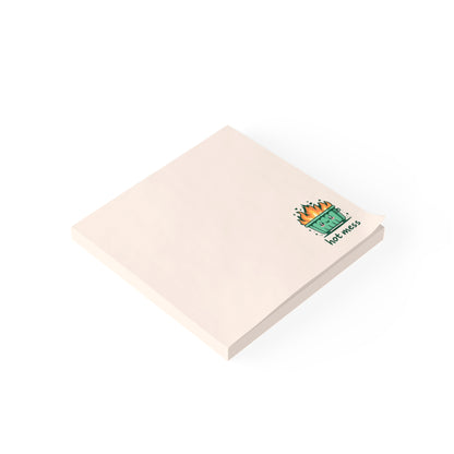 Beige notepad with a green and brown design on a white background