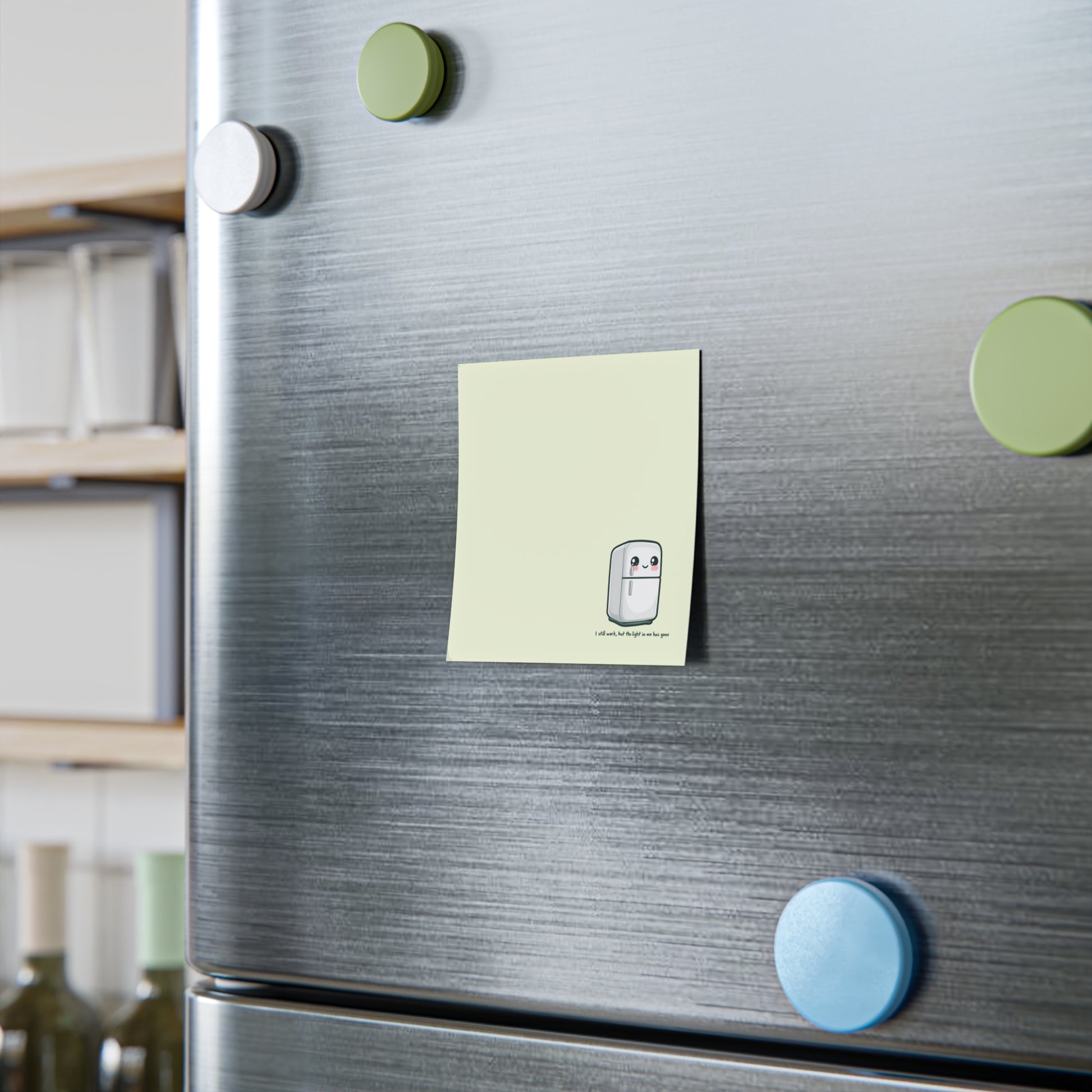 Fridge with colorful magnets and a sticky note attached
