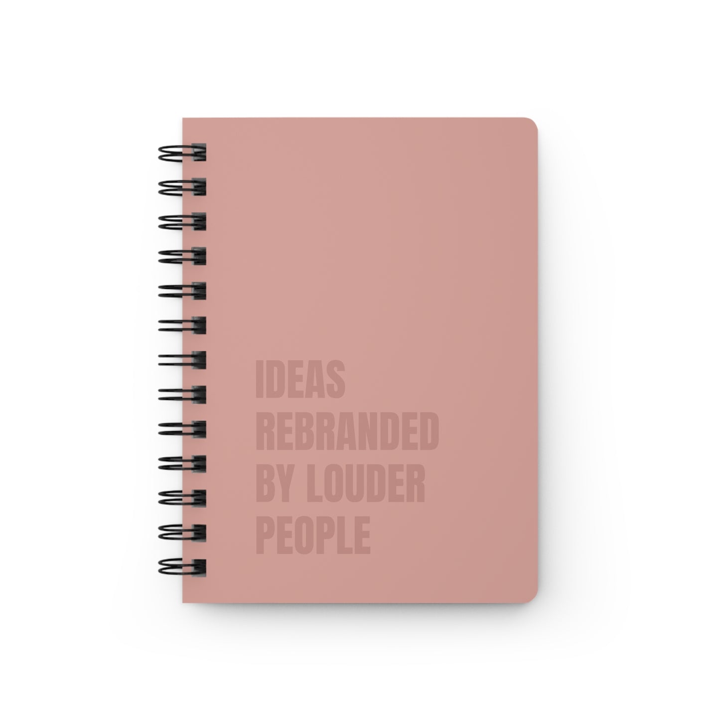 Pink notebook with text on a white background