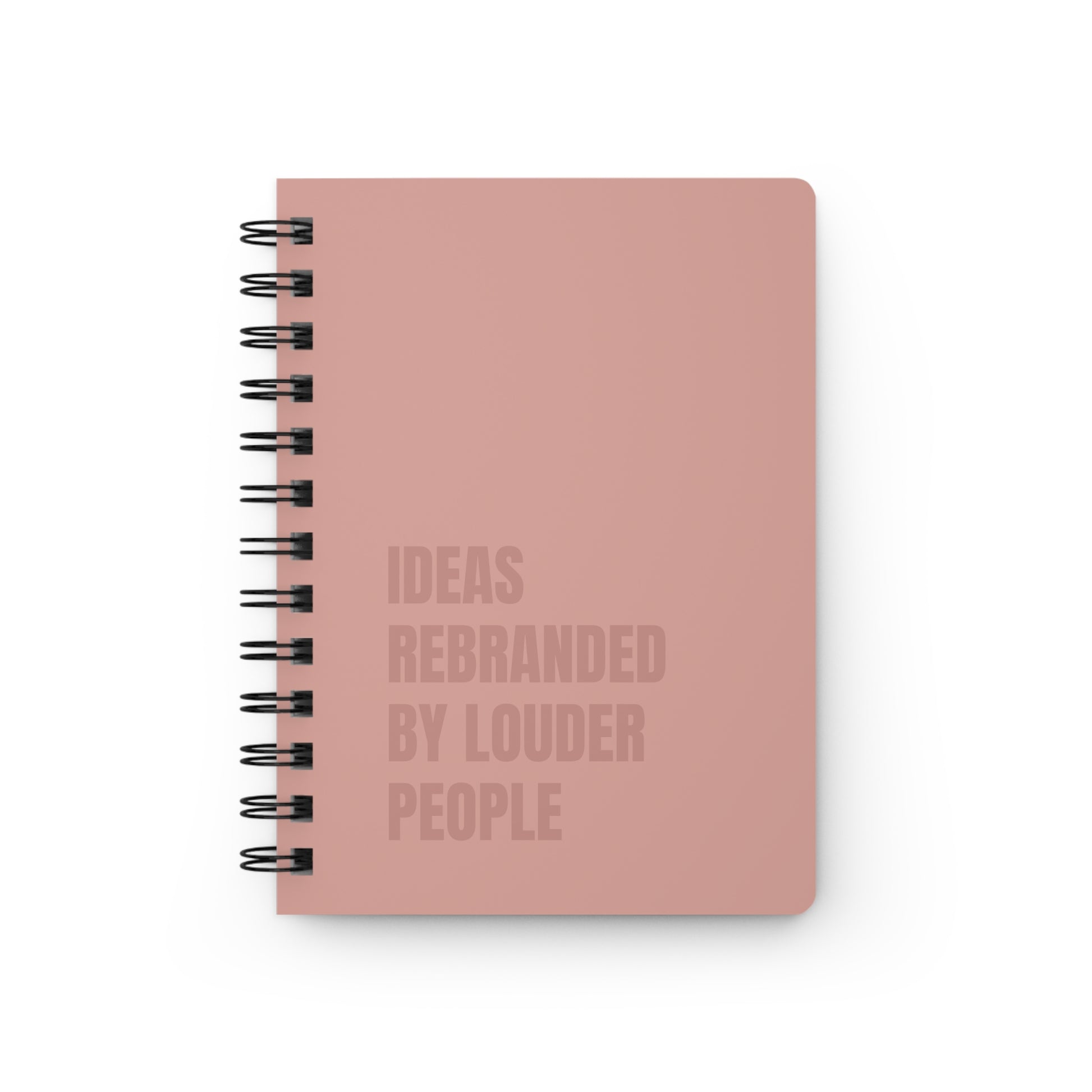 Pink notebook with text on a white background