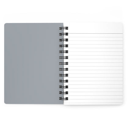 Gray notebook with a spiral binding on a white background