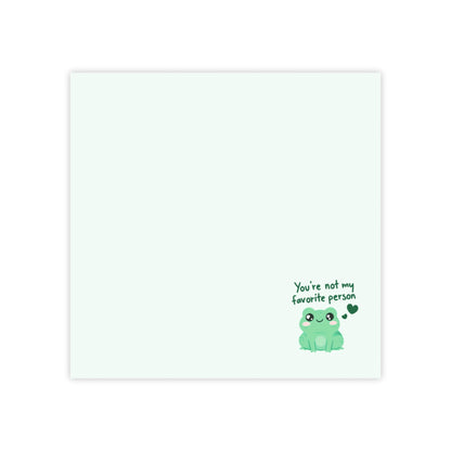 Card with a green frog illustration and text on a white background