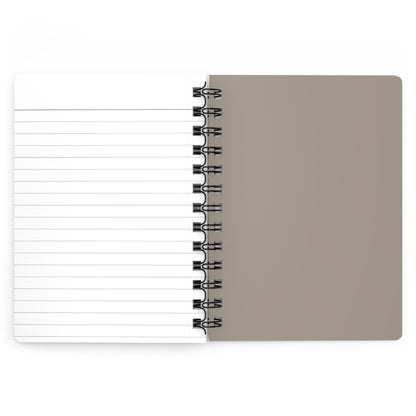 Spiral-bound notebook with beige cover and lined white pages on a white background