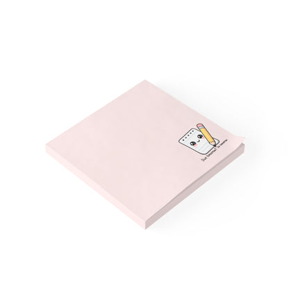 Pink notepad with a cartoon character on a white background