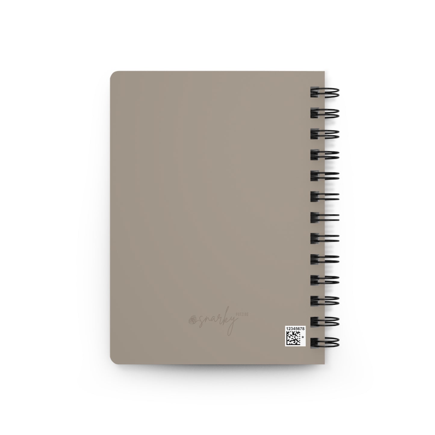 Beige notebook with spiral binding on a white background