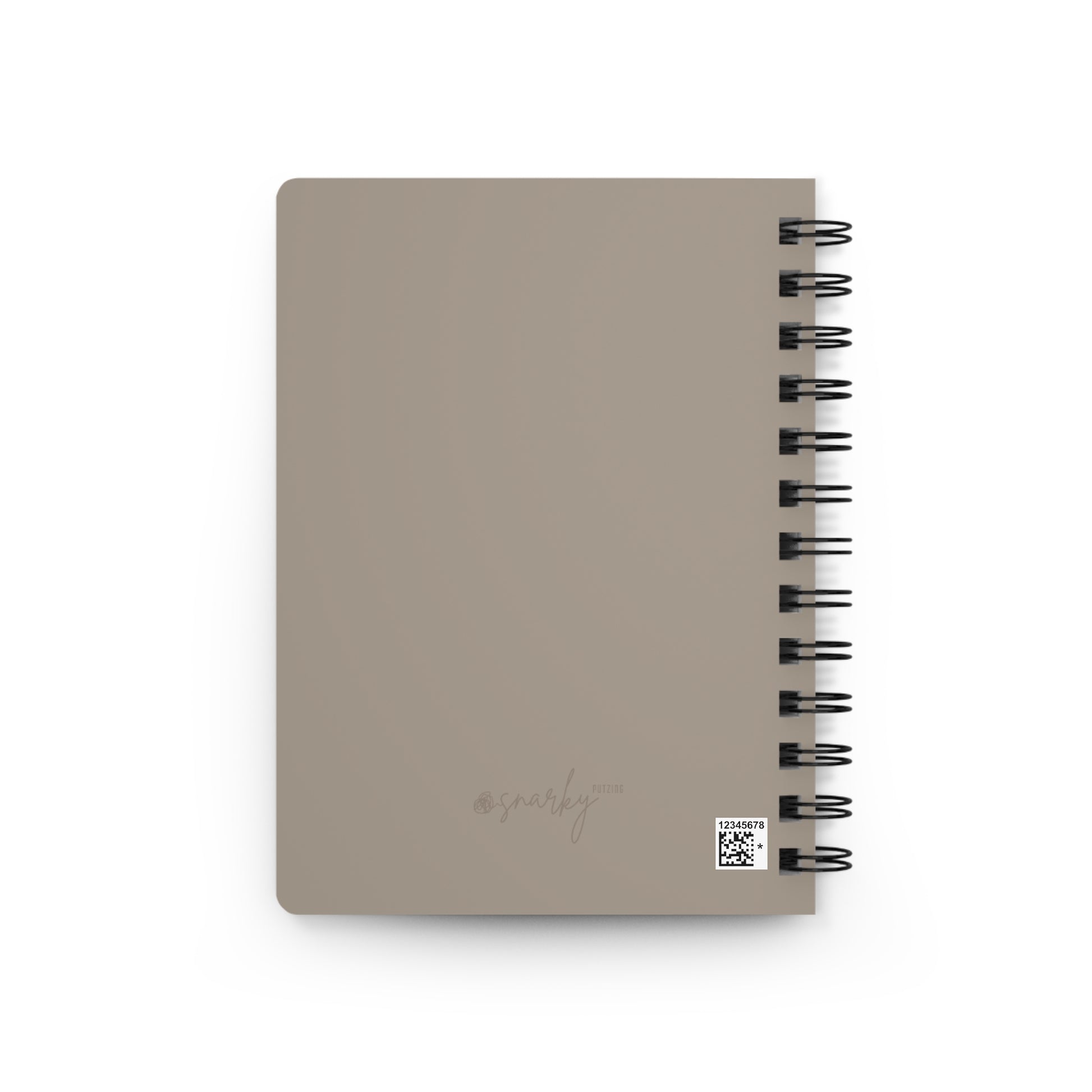 Beige notebook with spiral binding on a white background