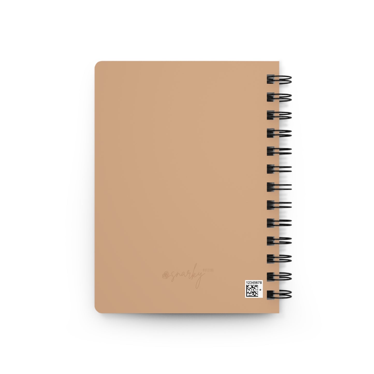 Beige notebook with spiral binding on a white background