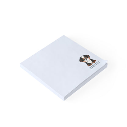 White notepad with a dog illustration and text on a white background