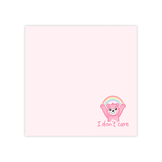 Cartoon bear with rainbow and 'I don't care' text on a pink background