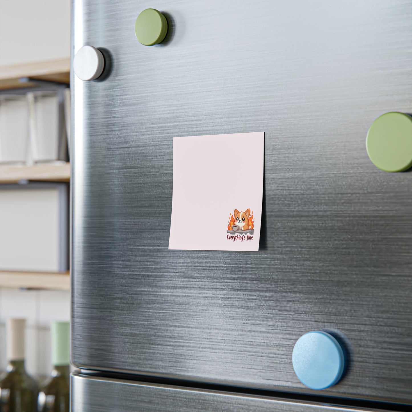 Note with a cat illustration attached to a refrigerator door with colorful magnets.