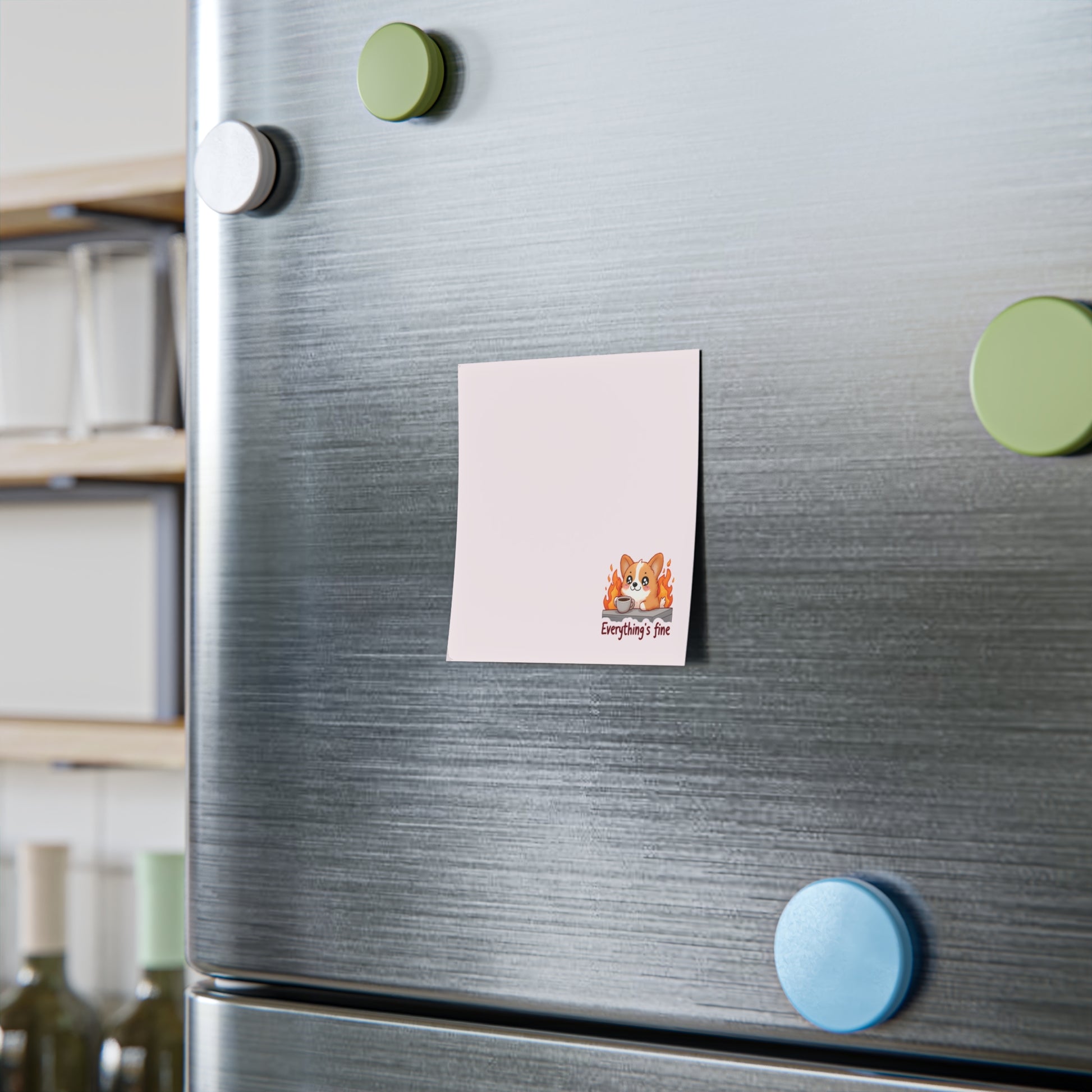 Note with a cat illustration attached to a refrigerator door with colorful magnets.
