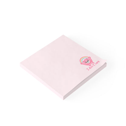 Pink notepad with a cartoon character and text on a white background
