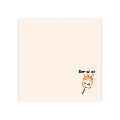 Notebook with a marshmallow on a stick illustration and 'Burned out' text on a beige background