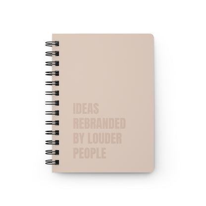 Beige notebook with text on a white background