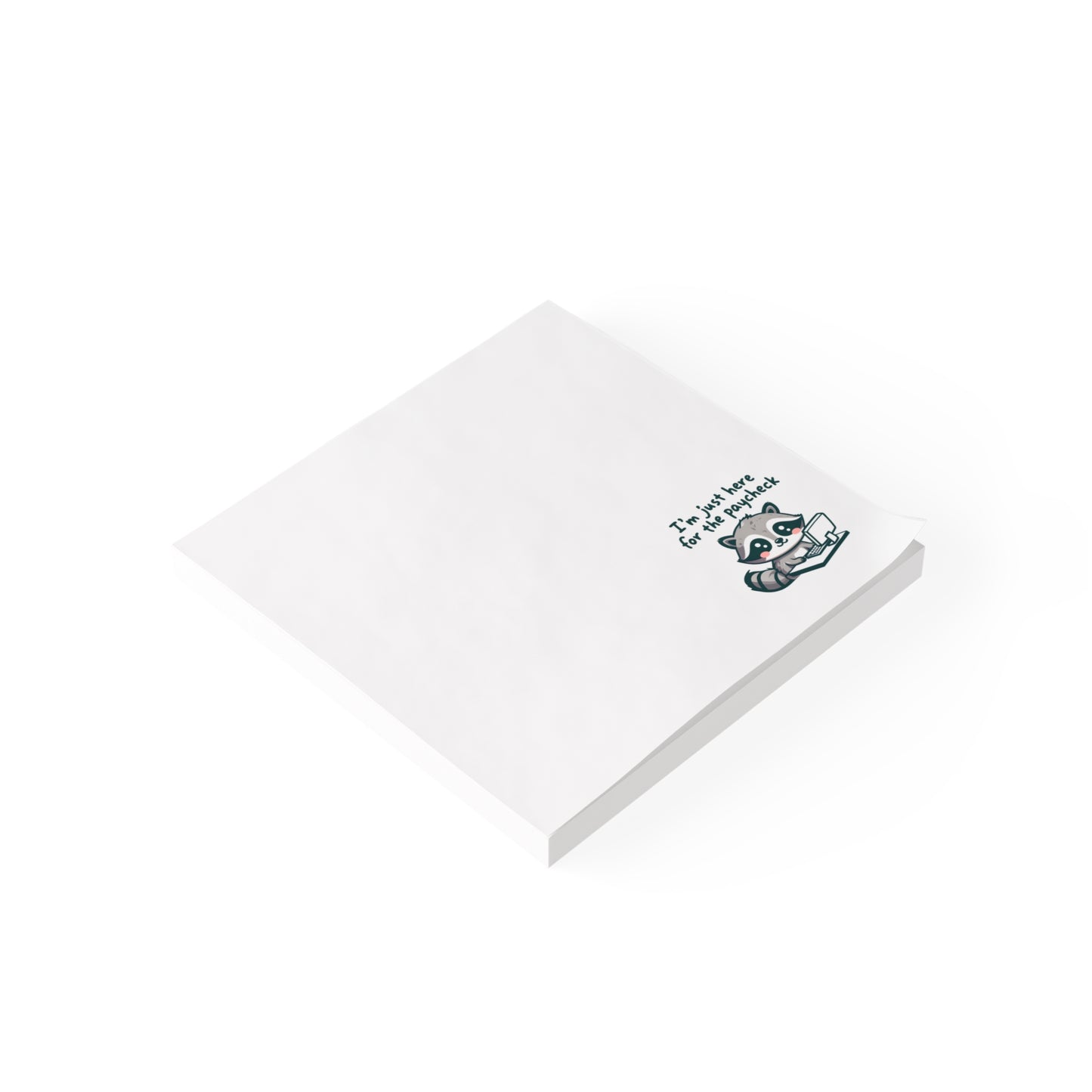 White sticky note pad shown at an angle on a white background, featuring the same raccoon illustration and “I’m just here for the paycheck” text in the bottom right corner.