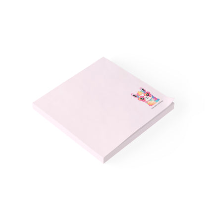 Pink notepad with a colorful cartoon character on a white background