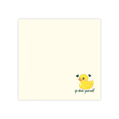 Notepad with a yellow duck illustration and text on a white background
