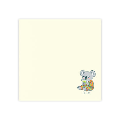 Notebook with a koala illustration and 'IDGAF' text on a light yellow background