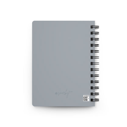 Gray notebook with spiral binding on a white background