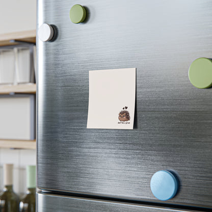 Fridge with colorful magnets and a note on a kitchen background