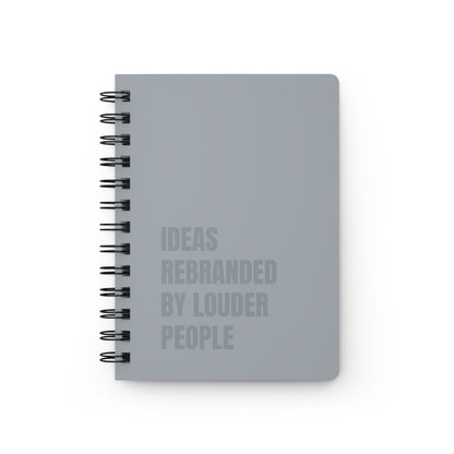 Gray notebook with text on a white background